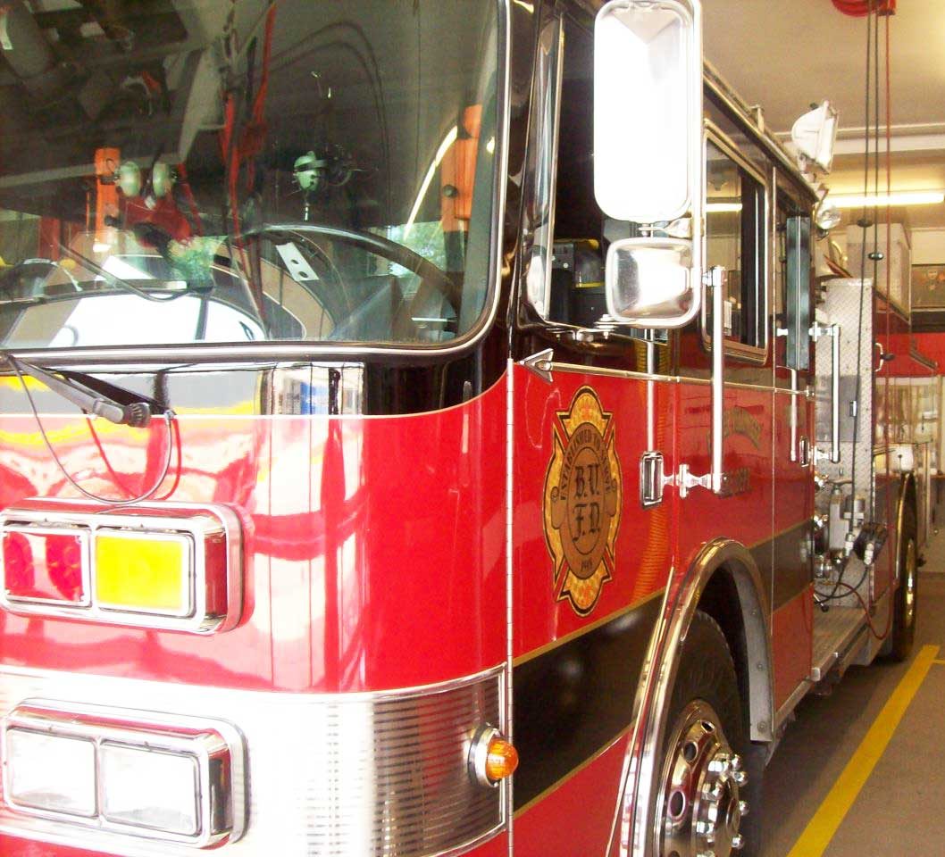 Fire apparatus gold-leaf lettering and striping by Custom Finishes