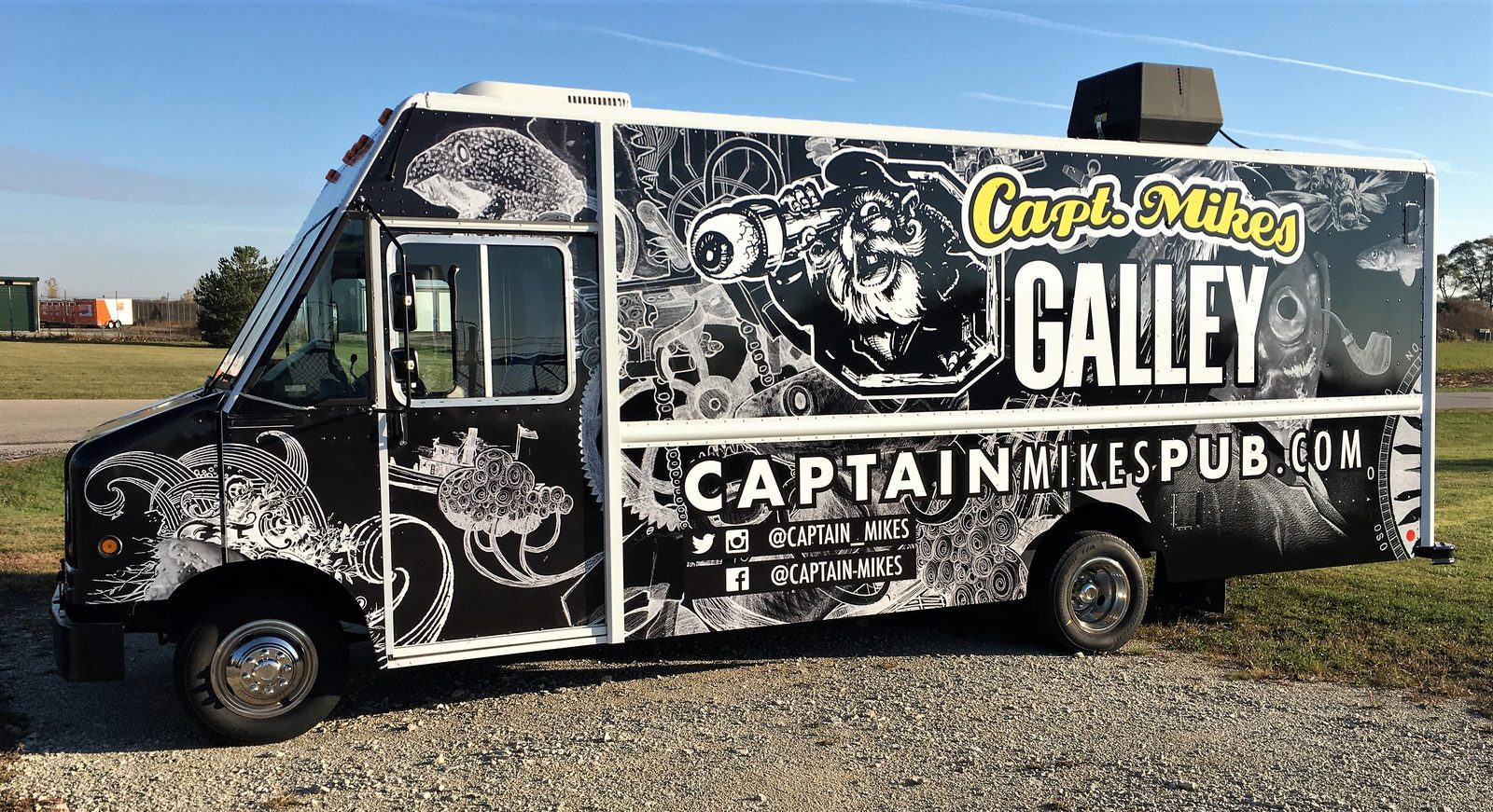 Food truck wrap by Custom Finishes for Capt. Mike's Galley, full black-and-white illustrated design with bold lettering